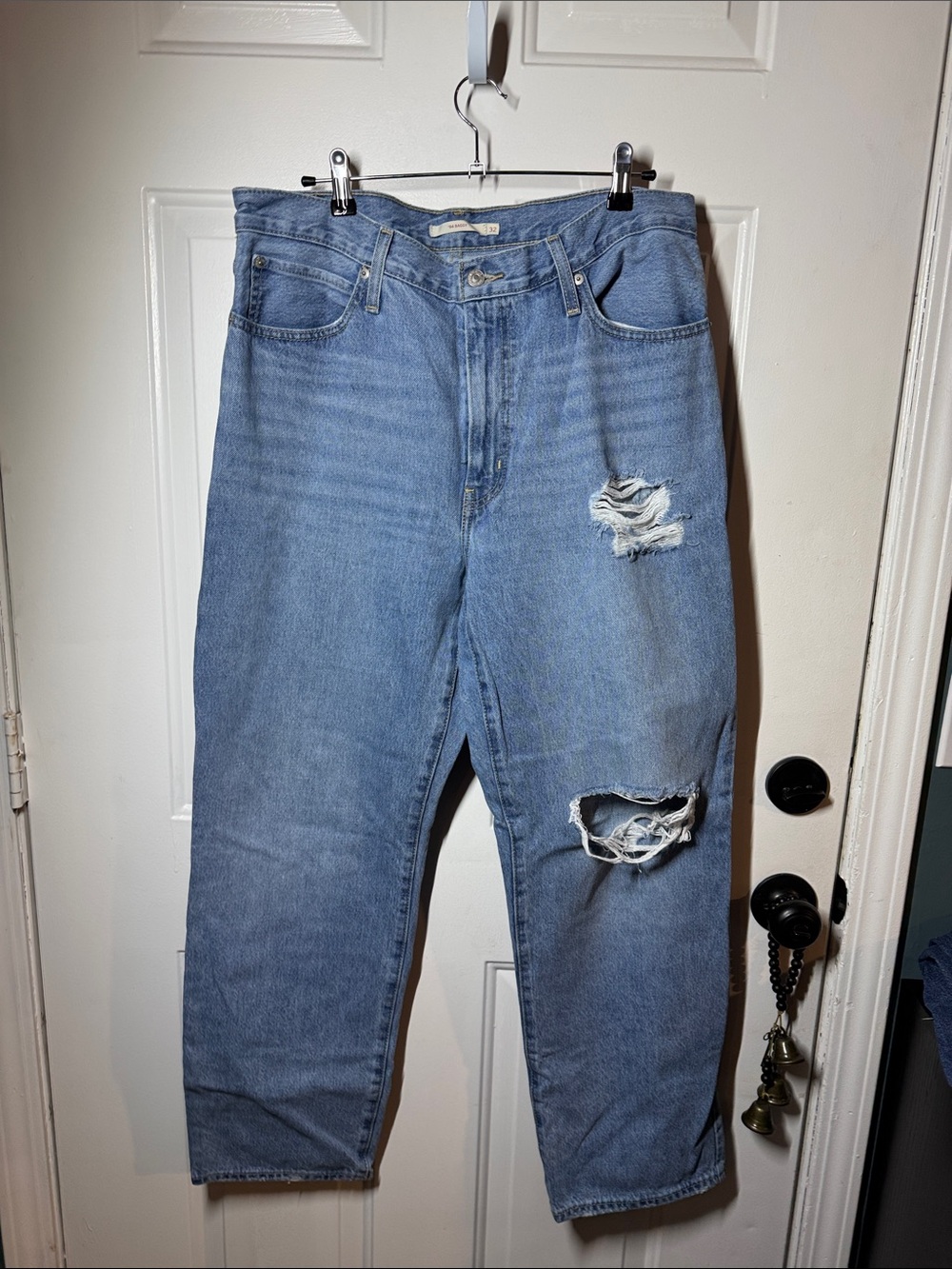 Woman’s Distressed Light Blue Denim Jeans